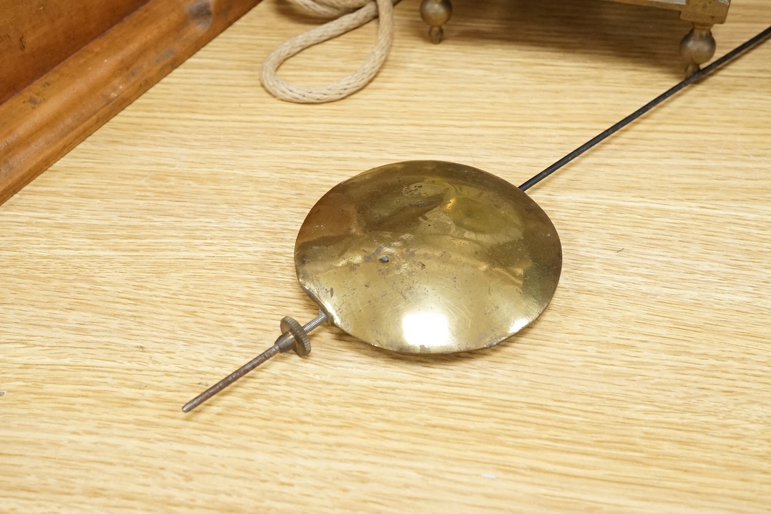 R. Arnold, Bodmin, a lantern clock on wooden wall shelf, clock 32cm high